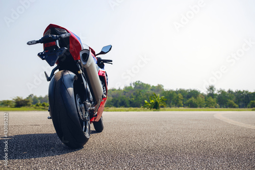 motorcycle parking on the road riding with soft-focus and over light in the background photo