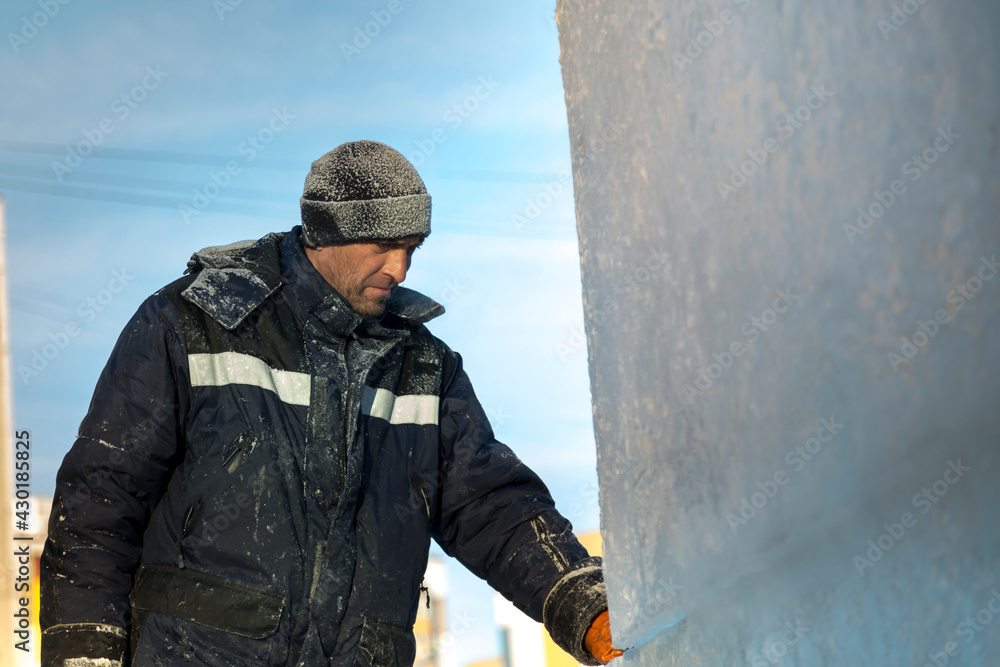 Portrait of the installer at the ice panel Portrait of the installer at the ice panel