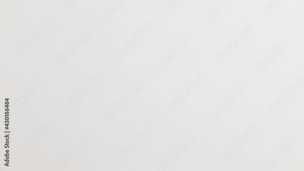 Stop Motion Animation_White paper ball unwrapping on orange background Stop Motion Animation_White paper ball unwrapping on orange background