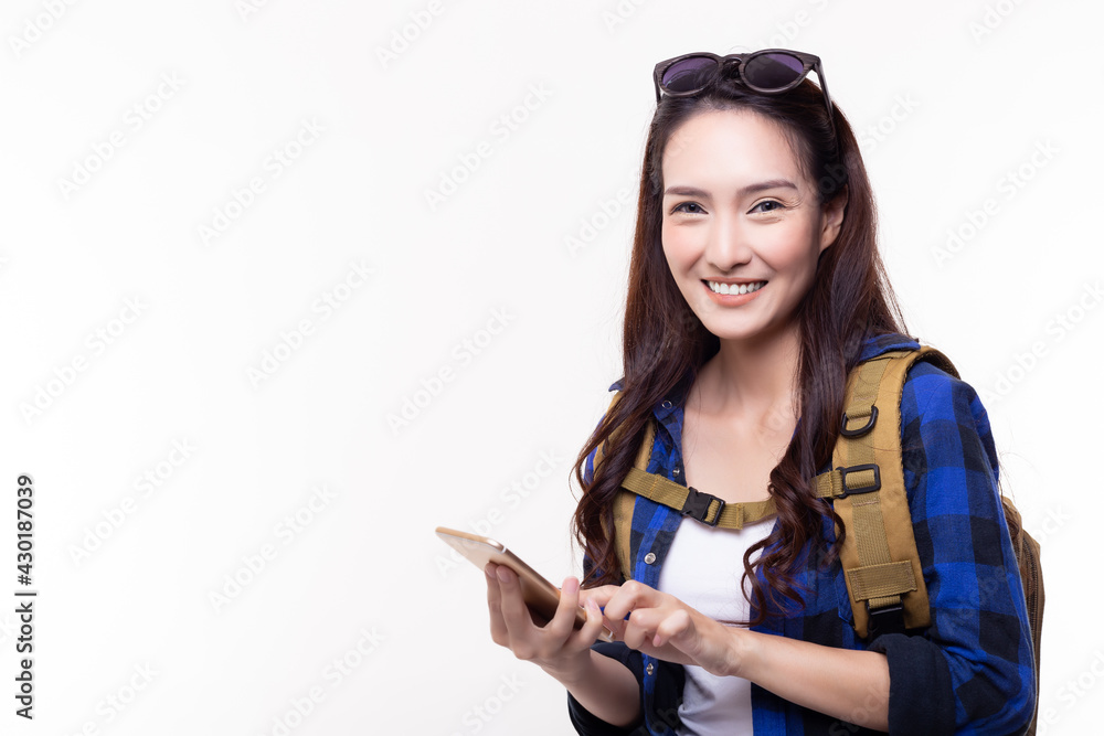 Happy young woman use smart phone for booking hotel or finding way to travel some destination Smiling Traveler girl get enjoy vacation time isolated on white background copy space Vacation destination Happy young woman use smart phone for booking hotel or finding way to travel some destination Smiling Traveler girl get enjoy vacation time isolated on white background copy space Vacation destination