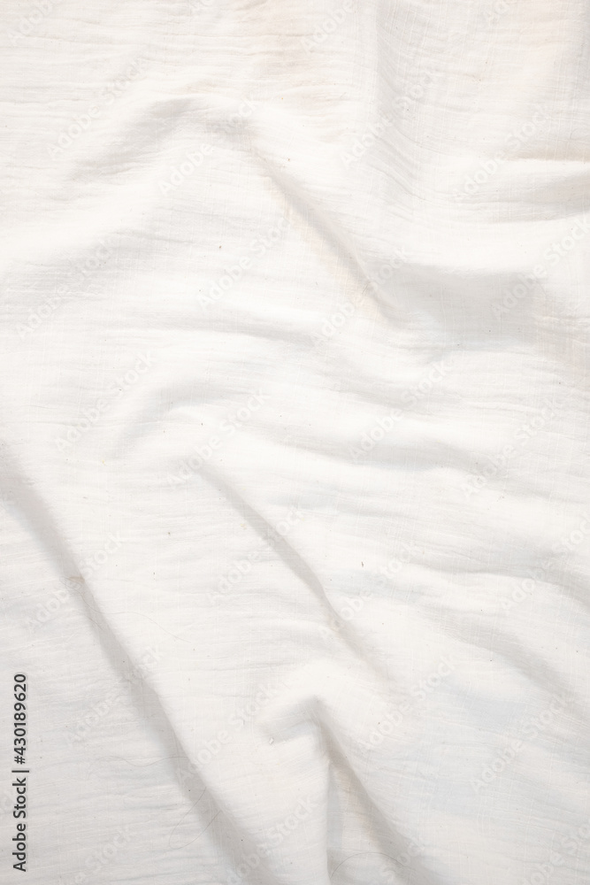 Fabric backdrop White linen canvas crumpled natural cotton fabric Natural handmade linen top view background Organic Eco textiles White Fabric texture