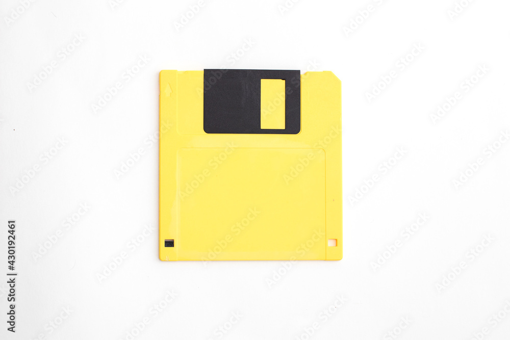 Yellow floppy disk on white background
