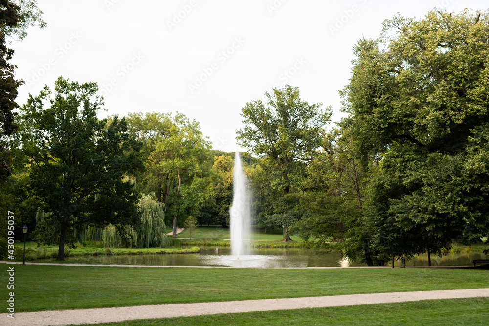 Big water fountain among beautiful public park in Frankfurt