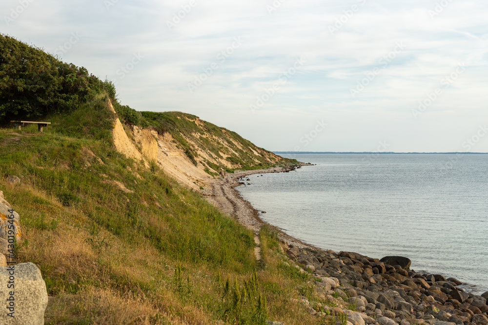 Aerial view of mountains with forest and beautiful shore by the sea