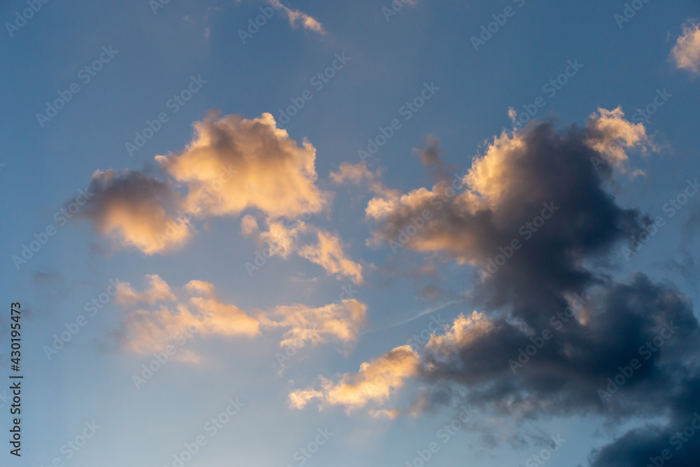 Close-up of beautiful shape rain cloud With the setting sun in the evening Close-up of beautiful shape rain cloud With the setting sun in the evening