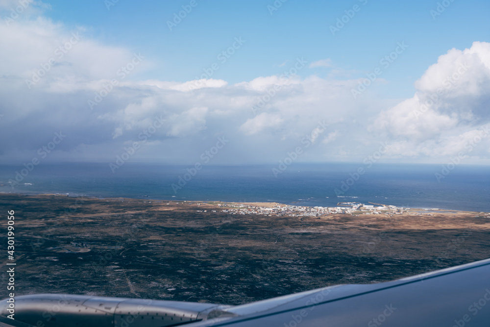 View of the rugged landscape of Iceland from the airplane window