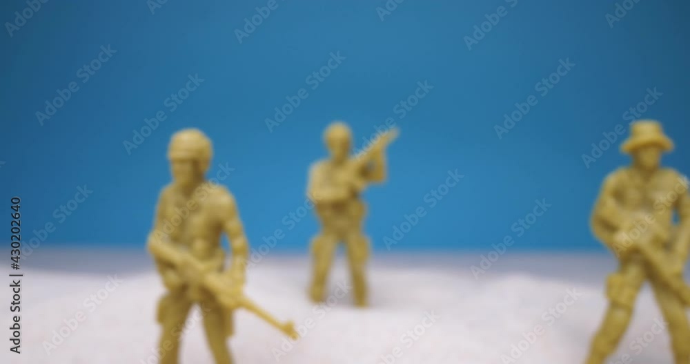 detailed extreme close-up. set of toy soldiers in the sand. detailed extreme close-up. set of toy soldiers in the sand.