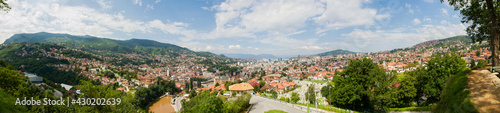 Panoramic view of Sarajevo the capital of Bosnia and Herzegovina. Houses, mountains, hills and roofs of the city seen from above