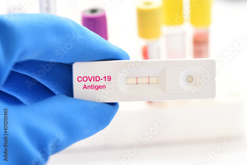 COVID-19 positive test result by using rapid card test for COVID-19 antigen  photo