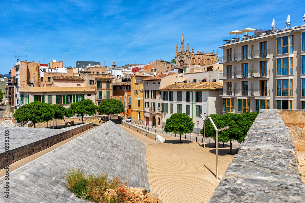 Small urban park and old houses in Palma,
