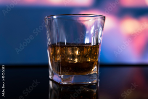 Glass of alcoholic drink with ice
