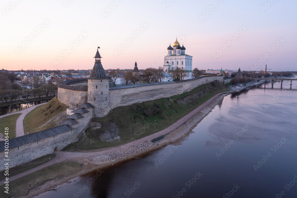 The main attractions of Pskov, a Russian city, a tourist center. Pskov Kremlin, Velikaya River, Trinity Cathedral. Sunrise.