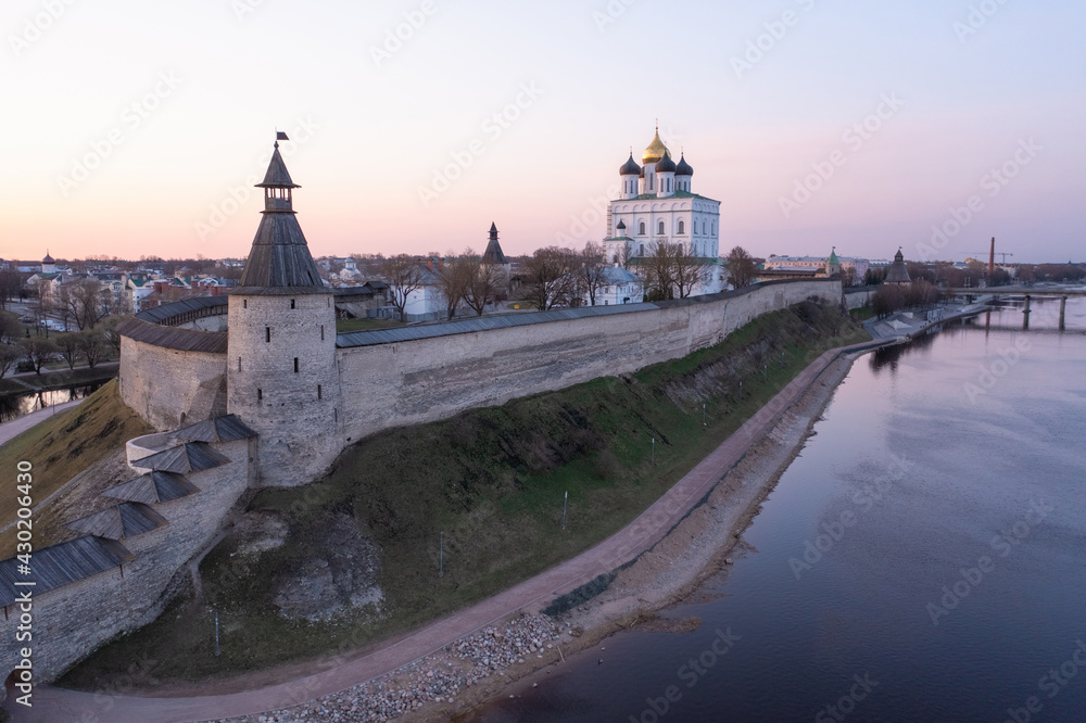 Bird eye view of the Pskov Kremlin and Trinity Cathedral and the Velikaya River. Sunrise.