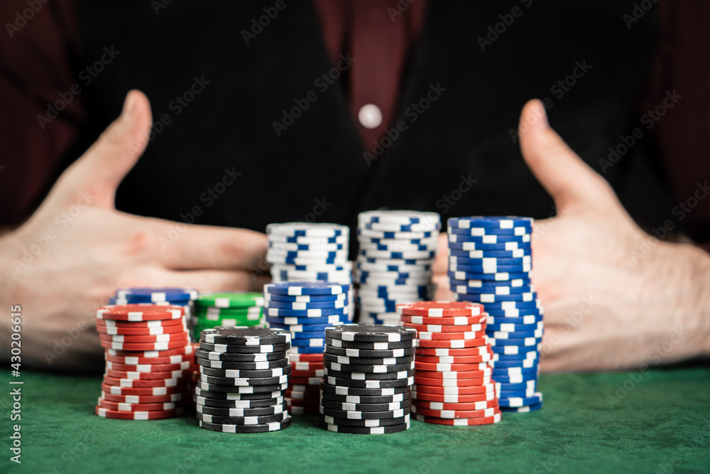 The poker player is ready to bet all his chips on the game.
The poker player is ready to bet all his chips on the game.