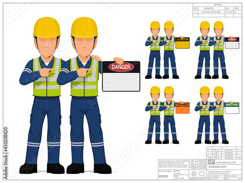 Two industrial workers are presenting warning sign on white background