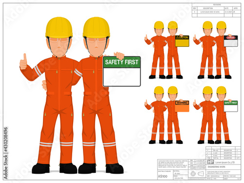 Two industrial workers are presenting warning sign on white background