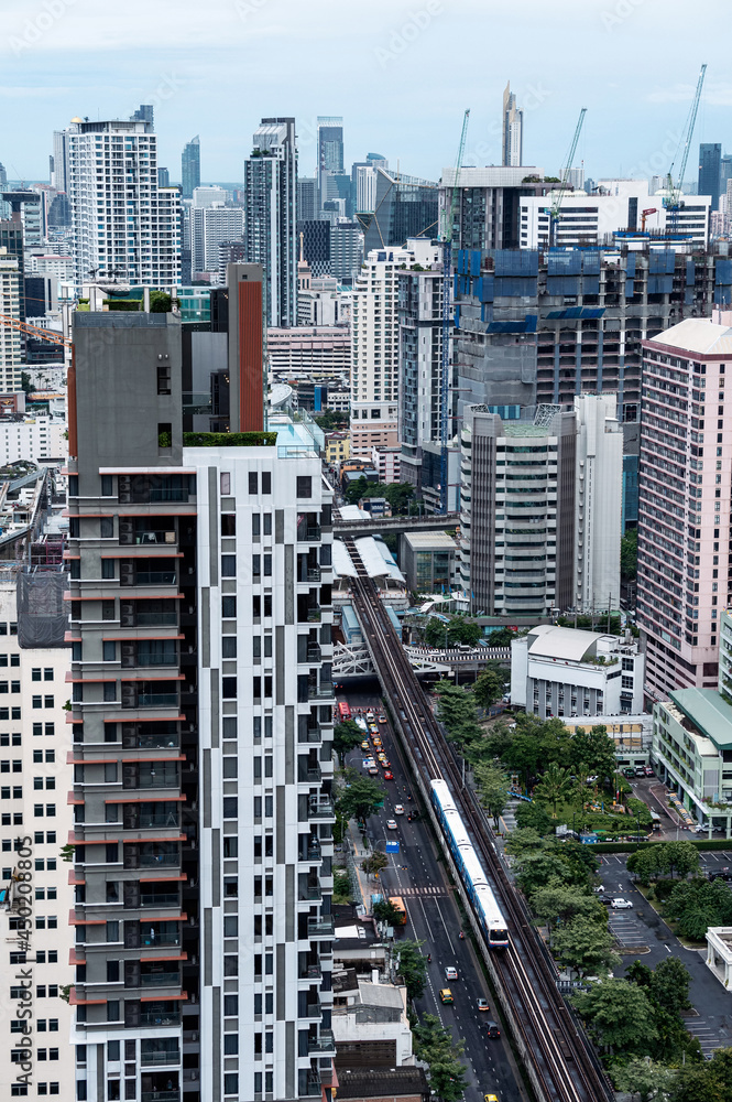 Bangkok city with crowded building and public skytrain at Thailand