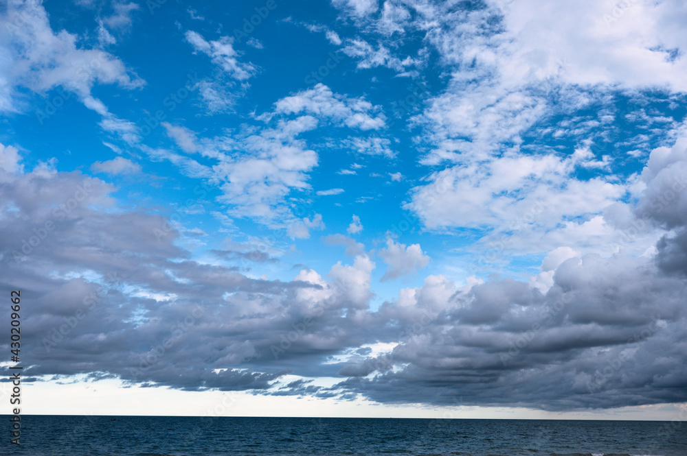 Cloudy on blue sky over the sea Cloudy on blue sky over the sea