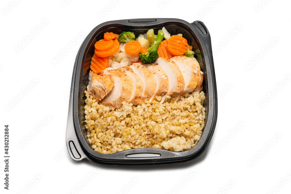 Ready food in a container. Stewed chicken, stewed carrot, cabbage and porridge. Ready food in a container. Stewed chicken, stewed carrot, cabbage and porridge.