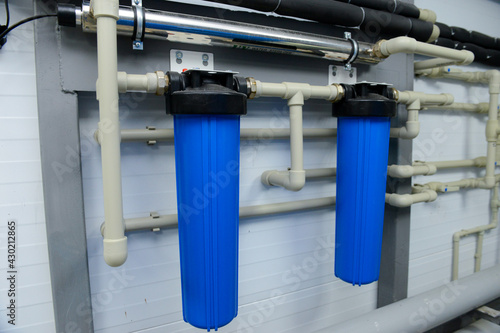 Water pipes filters blue. Kitchen equipment.