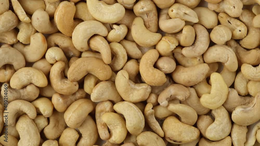 raw cashew nuts top view rotation. Healthy Food. 4K UHD video raw cashew nuts top view rotation. Healthy Food. 4K UHD video