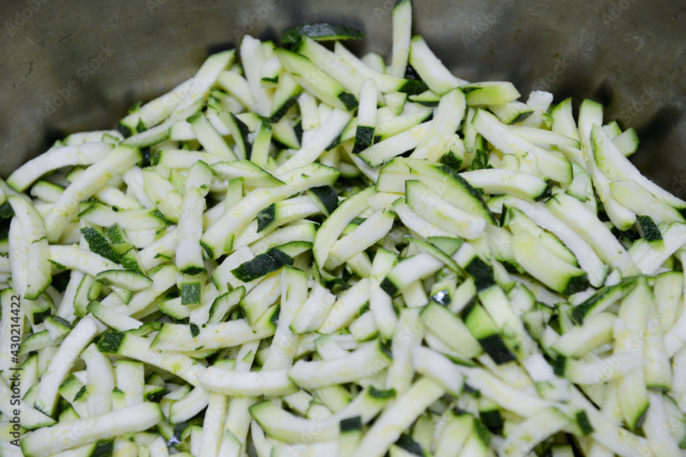 Finely chopped green cucumbers. Close-up. Finely chopped green cucumbers. Close-up.
