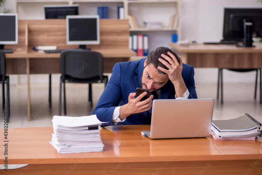 Young businessman employee working at workplace Young businessman employee working at workplace