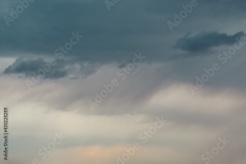 Overcast sky with rainy clouds. Dark grey abstract background. Bad weather.