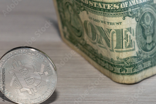 bitcoin coin on a dollar background