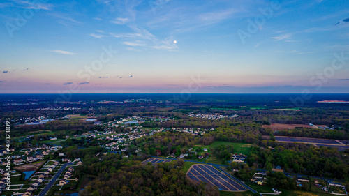 Aerial photo of farm land in Vineland, New Jersey with a waxing Moon above the horizon. 