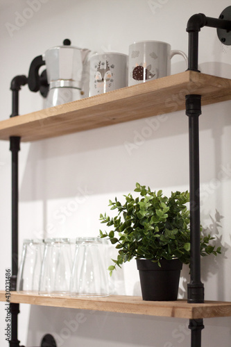 coffee shop shelf with coffee maker and crystal glasses