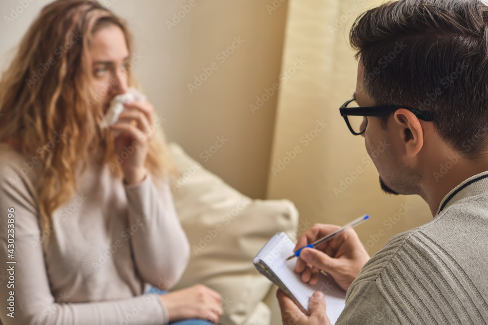 Female patient explaining purpose of a visit to psychologist Female patient explaining purpose of a visit to psychologist