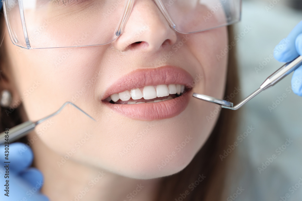 Portrait of woman with white beautiful teeth at dentist appointment Portrait of woman with white beautiful teeth at dentist appointment