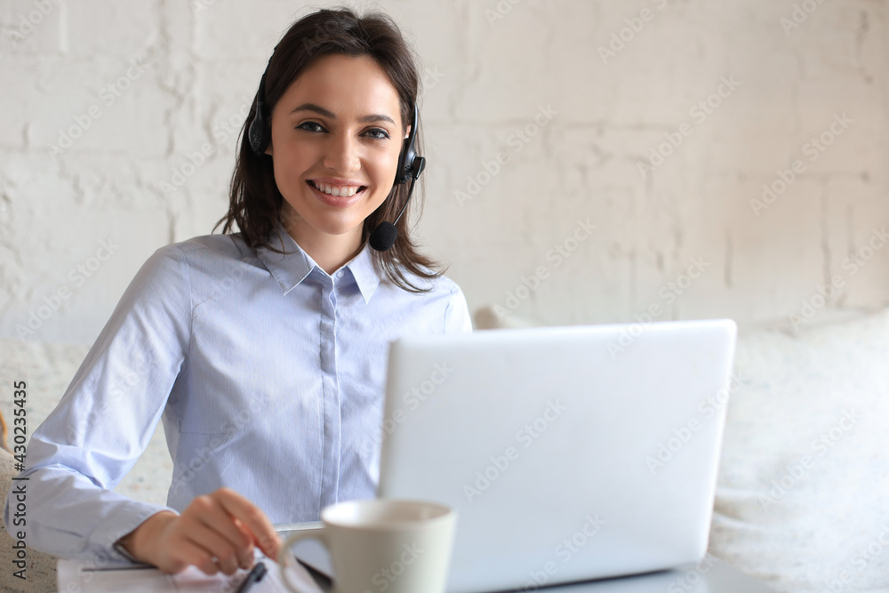 Freelance operator talking with headsets and consulting clients from home office. Freelance operator talking with headsets and consulting clients from home office.