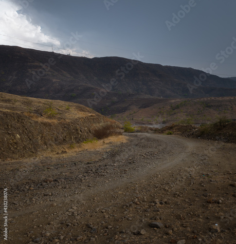 Beautiful evening off road view from Kanifnath ghat at bopgoan , Pune. Road goes through connecting different mountains and hills