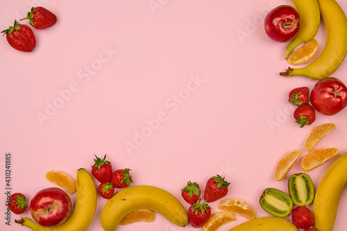 fruits and berries on a light background with a place to insert
