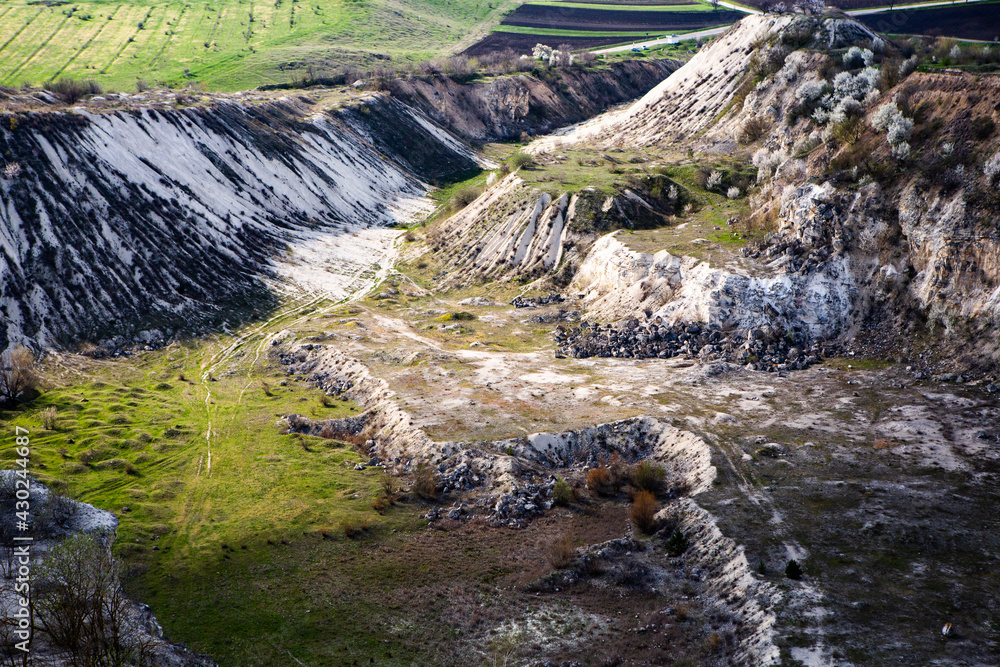 Abandoned limestone quarry. Interesting form of relief. Amazing hills and ground. Dry areas of the earth. Global warming Abandoned limestone quarry. Interesting form of relief. Amazing hills and ground. Dry areas of the earth. Global warming