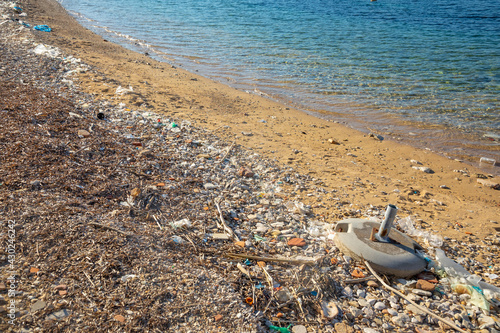 Beach polluted with plastic garbage due to sea currents, Vis island, Croatia. © dtatiana