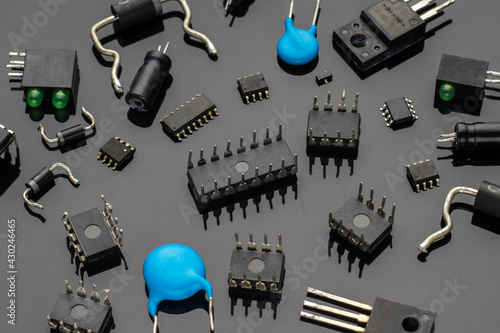 Various electronic components on a black background photo