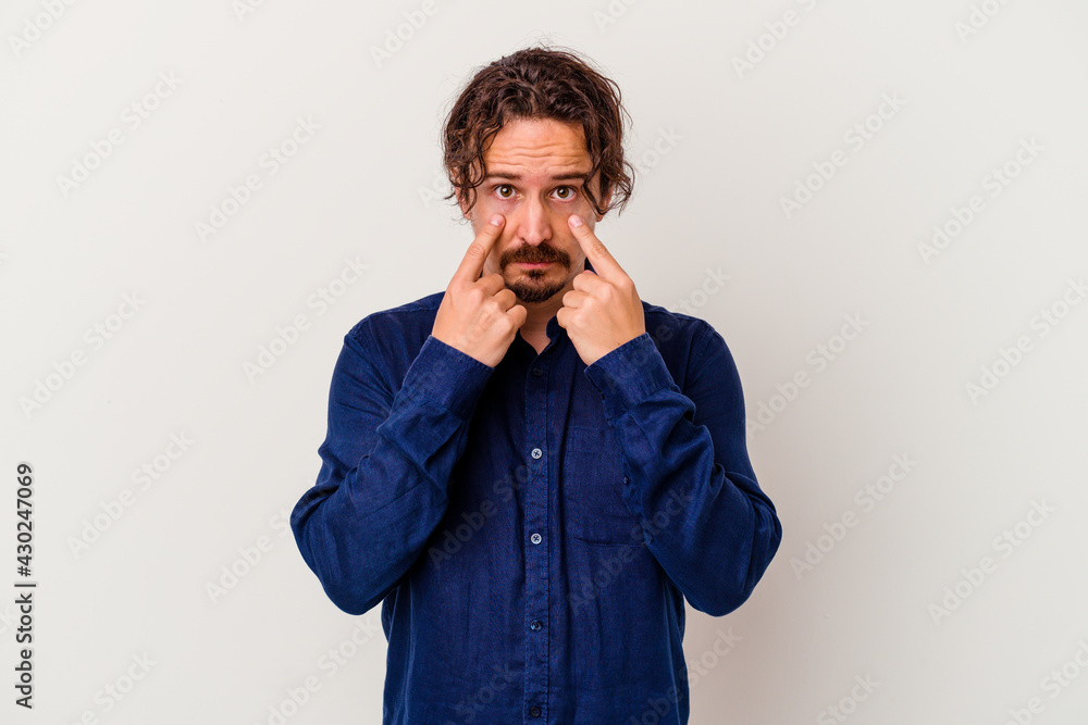 Young caucasian man isolated on white background crying, unhappy with something, agony and confusion concept. Young caucasian man isolated on white background crying, unhappy with something, agony and confusion concept.