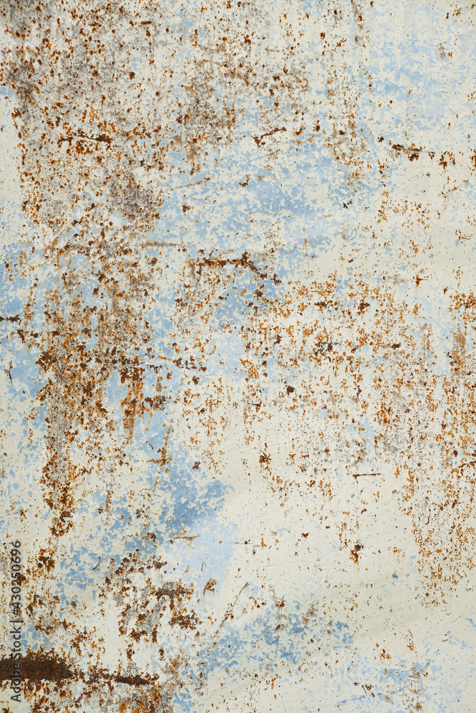 Beautiful abstract wall texture background. Blue, white and brown. Creative backdrop design. Rusty metal wall fragment. Old worn iron plate with peeled off paint and scratches. Close up, copy space