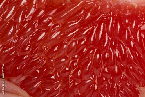 The pulp of a red grapefruit close-up. Closeup.