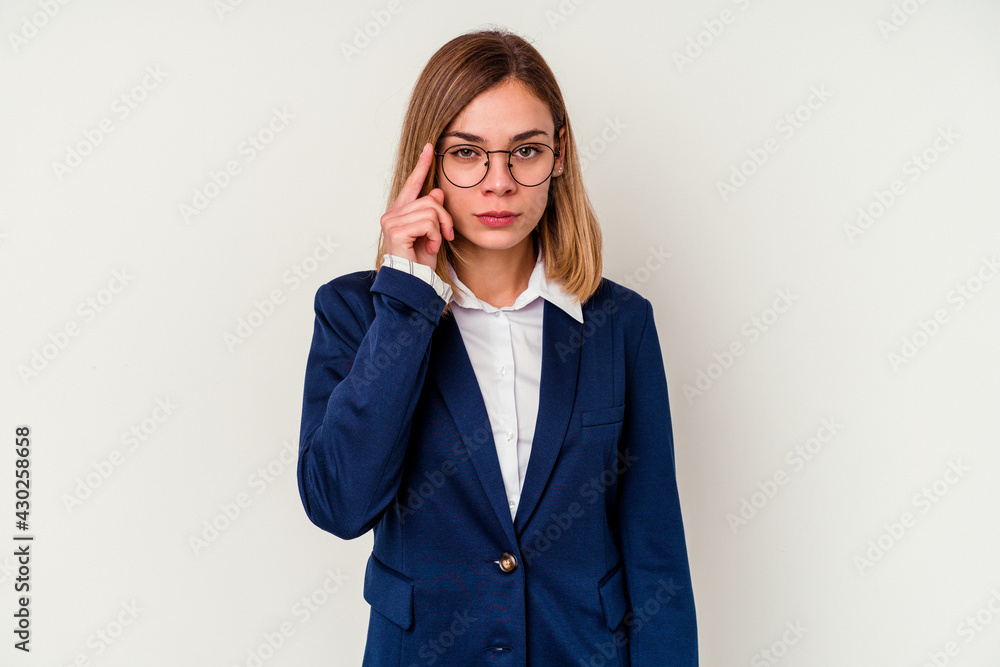Young business caucasian woman isolated on white background pointing temple with finger, thinking, focused on a task. Young business caucasian woman isolated on white background pointing temple with finger, thinking, focused on a task.