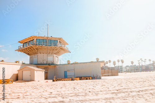 Sandy beach at Venice Beach in Los Angeles, blue lifeguard towers on a sunny day