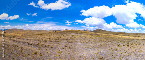 Sunny day in a yellow field due to dry weather and fall season photo