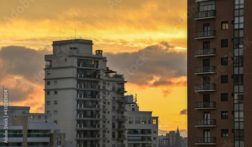 Amber sky between buildings