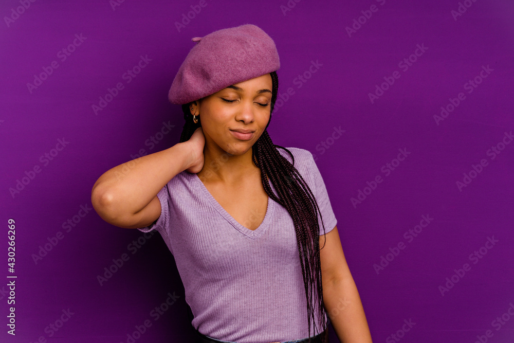 Young african american woman isolated on yellow background Young african american woman isolated on yellow background having a neck pain due to stress, massaging and touching it with hand. Young african american woman isolated on yellow background Young african american woman isolated on yellow background having a neck pain due to stress, massaging and touching it with hand.