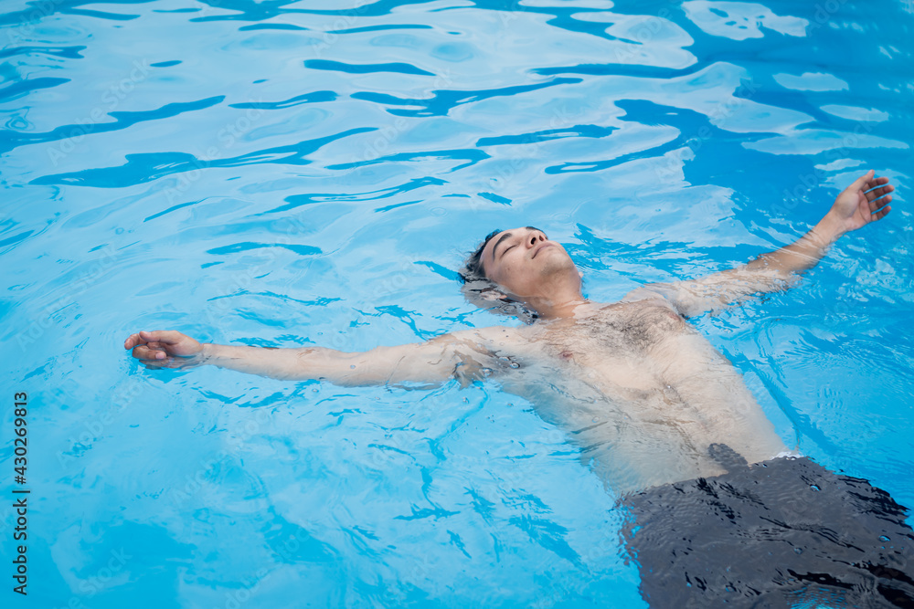 men in a pool, men swimming in a pool