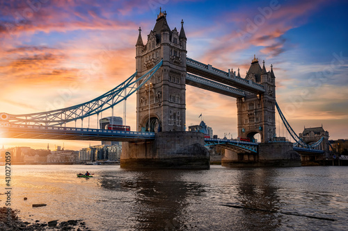 Low angle view of the landmark Tower Bridge in London, United Kingdom, during a colorful sunset