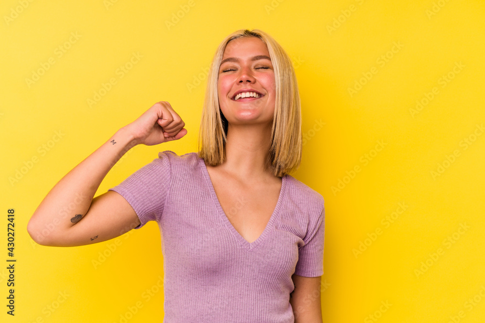 Young venezuelan woman isolated on yellow background celebrating a victory, passion and enthusiasm, happy expression. Young venezuelan woman isolated on yellow background celebrating a victory, passion and enthusiasm, happy expression.